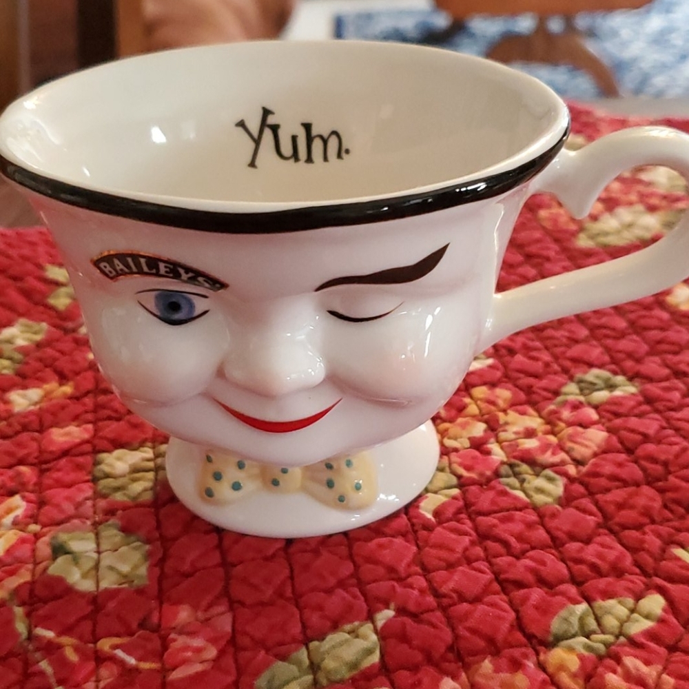 Bailey's winking cup. Yum inside. Yellow bowtie